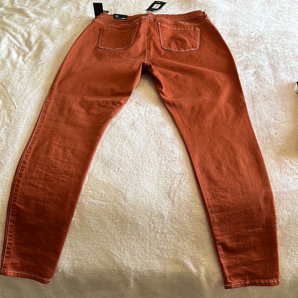 Lilac stretch skinny Jean. These are in a rust orange color w/ white stitching. - Picture 3 of 4